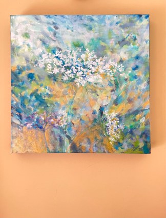 Painting hanging against a golden wall